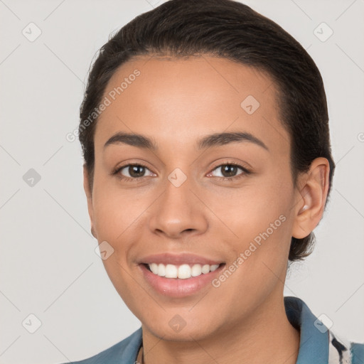 Joyful white young-adult female with short  brown hair and brown eyes