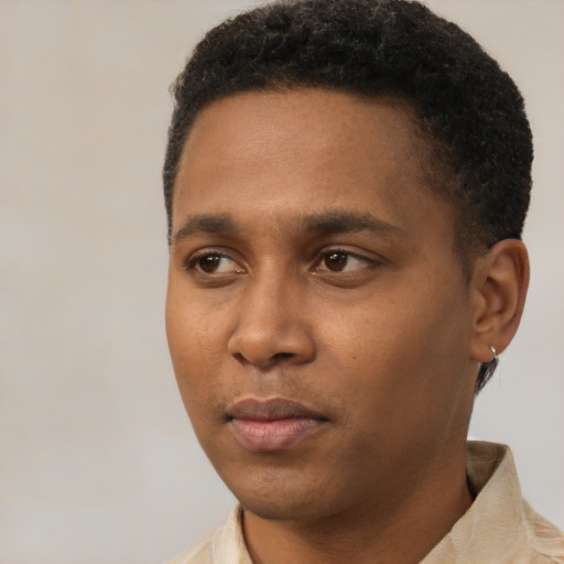 Neutral black young-adult male with short  black hair and brown eyes