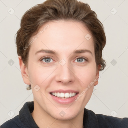 Joyful white young-adult female with short  brown hair and grey eyes