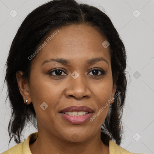 Joyful black adult female with medium  brown hair and brown eyes