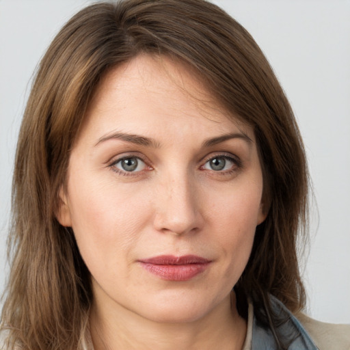 Neutral white young-adult female with long  brown hair and grey eyes