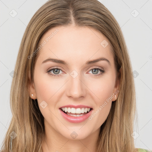 Joyful white young-adult female with long  brown hair and green eyes