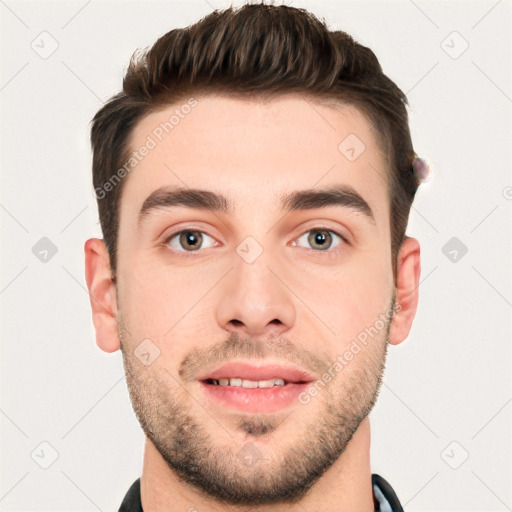 Joyful white young-adult male with short  brown hair and grey eyes