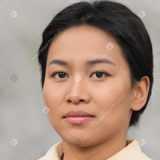 Joyful asian young-adult female with medium  brown hair and brown eyes