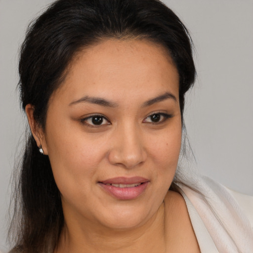 Joyful white adult female with medium  brown hair and brown eyes