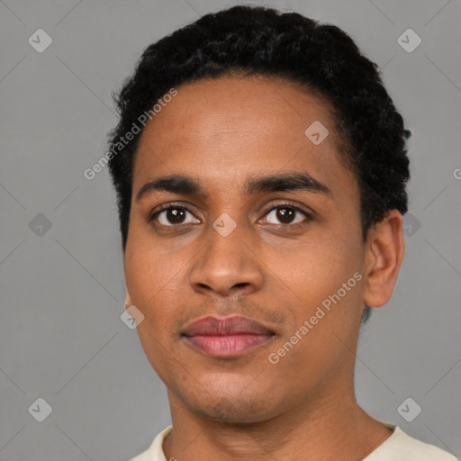 Joyful black young-adult male with short  black hair and brown eyes