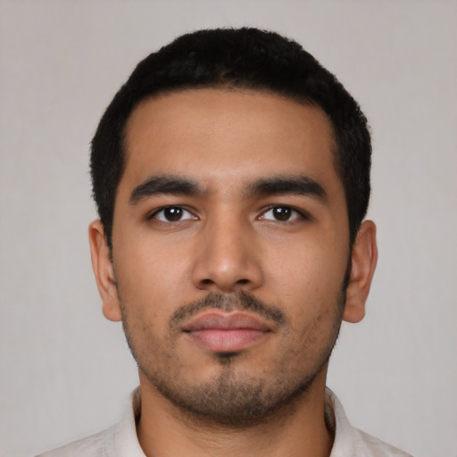 Neutral latino young-adult male with short  black hair and brown eyes