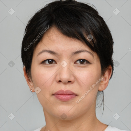 Joyful white adult female with short  brown hair and brown eyes