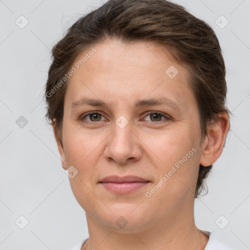 Joyful white adult female with short  brown hair and brown eyes