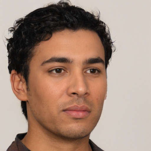 Neutral latino young-adult male with short  brown hair and brown eyes