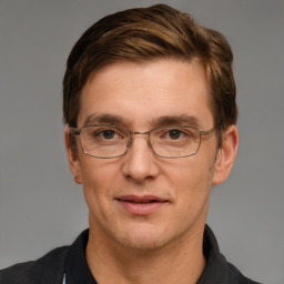 Joyful white adult male with short  brown hair and grey eyes