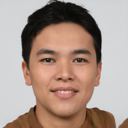 Joyful asian young-adult male with short  brown hair and brown eyes