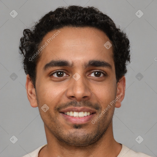 Joyful latino young-adult male with short  brown hair and brown eyes