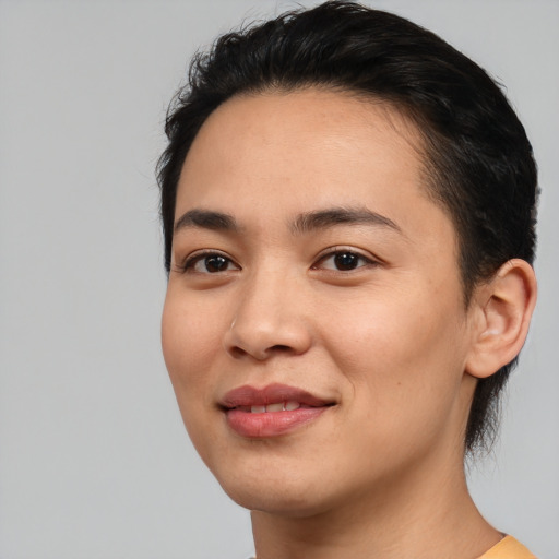Joyful white young-adult female with short  black hair and brown eyes