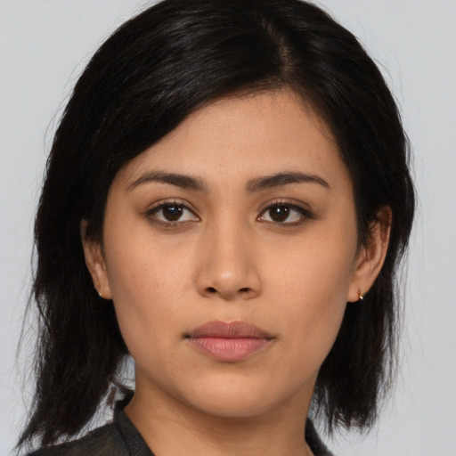 Neutral asian young-adult female with medium  brown hair and brown eyes