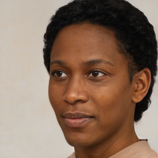 Neutral black young-adult female with short  black hair and brown eyes