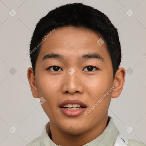 Joyful asian young-adult male with short  black hair and brown eyes