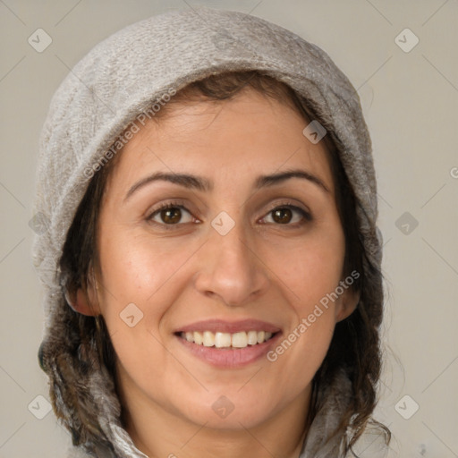 Joyful white adult female with medium  brown hair and brown eyes