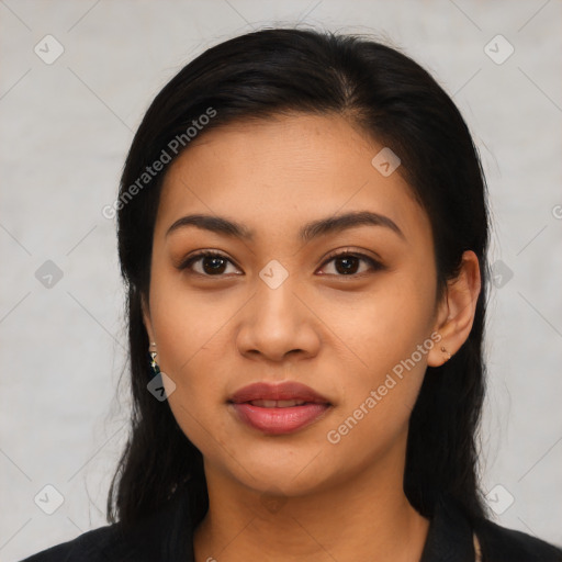 Joyful latino young-adult female with long  black hair and brown eyes