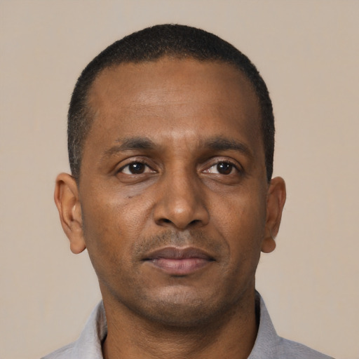 Neutral black young-adult male with short  black hair and brown eyes