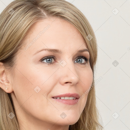 Joyful white young-adult female with long  brown hair and blue eyes