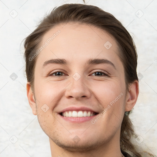 Joyful white young-adult female with short  brown hair and brown eyes