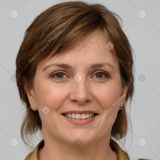 Joyful white adult female with medium  brown hair and grey eyes