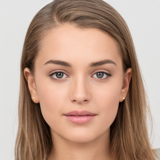 Neutral white young-adult female with long  brown hair and brown eyes