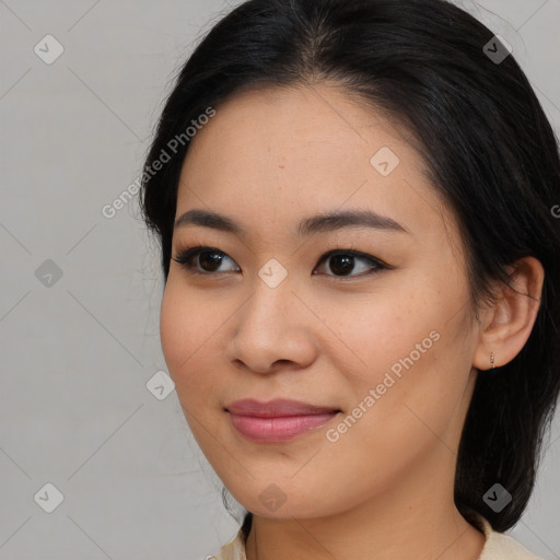 Joyful asian young-adult female with medium  brown hair and brown eyes