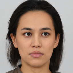 Neutral asian young-adult female with medium  brown hair and brown eyes