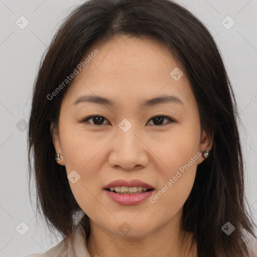 Joyful asian young-adult female with medium  brown hair and brown eyes