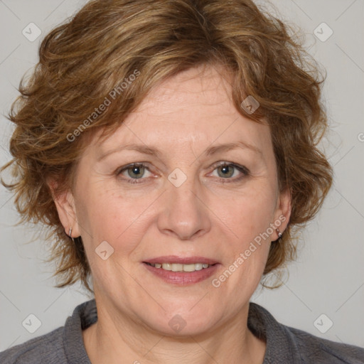 Joyful white adult female with medium  brown hair and blue eyes