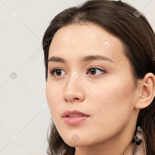 Neutral white young-adult female with long  brown hair and brown eyes