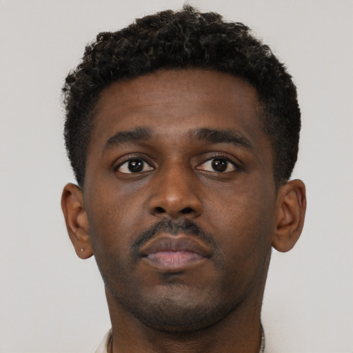 Neutral black young-adult male with short  brown hair and brown eyes