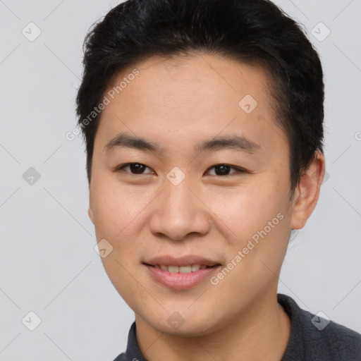 Joyful asian young-adult male with short  brown hair and brown eyes