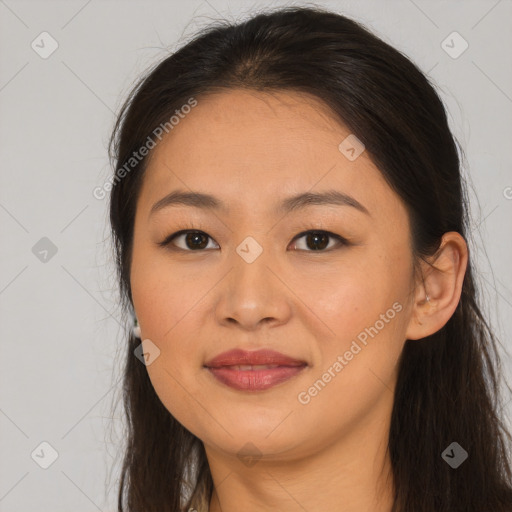 Joyful asian young-adult female with long  brown hair and brown eyes