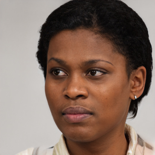 Neutral black young-adult female with medium  black hair and brown eyes