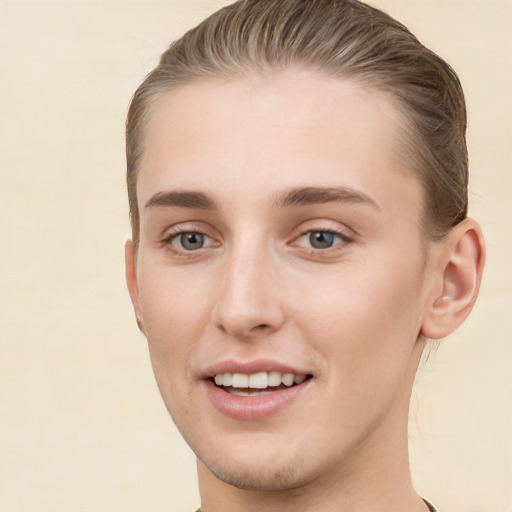 Joyful white young-adult female with short  brown hair and grey eyes