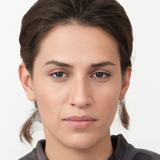 Neutral white young-adult female with medium  brown hair and brown eyes