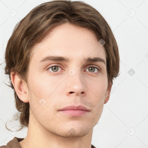 Neutral white young-adult male with short  brown hair and grey eyes