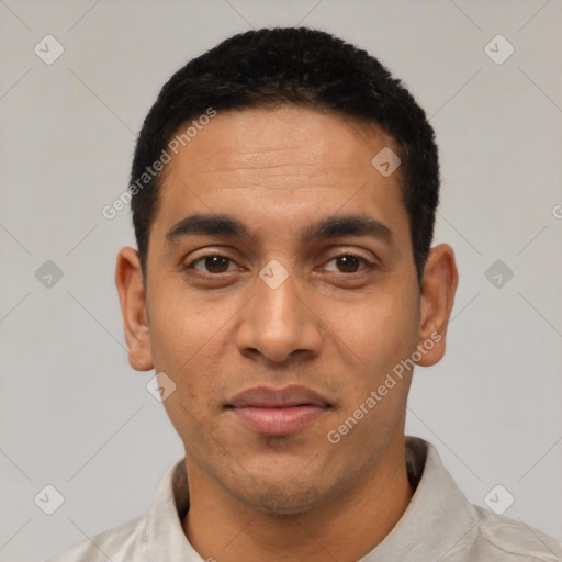 Joyful latino young-adult male with short  black hair and brown eyes