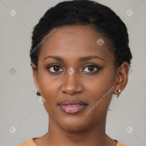 Joyful black young-adult female with short  brown hair and brown eyes