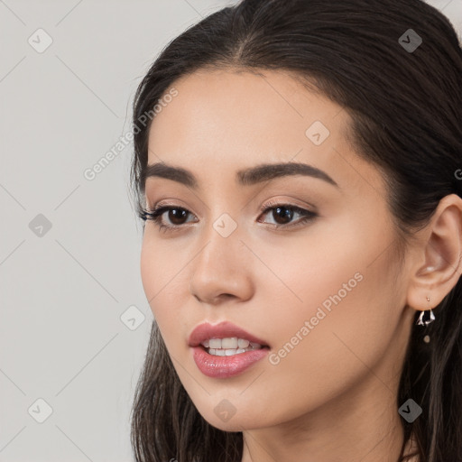 Joyful white young-adult female with long  black hair and brown eyes