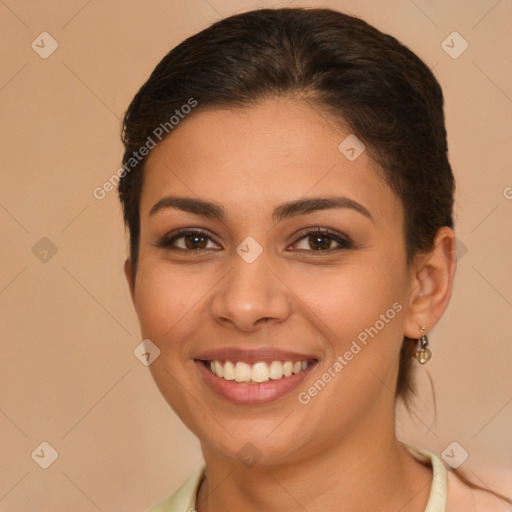 Joyful white young-adult female with long  brown hair and brown eyes