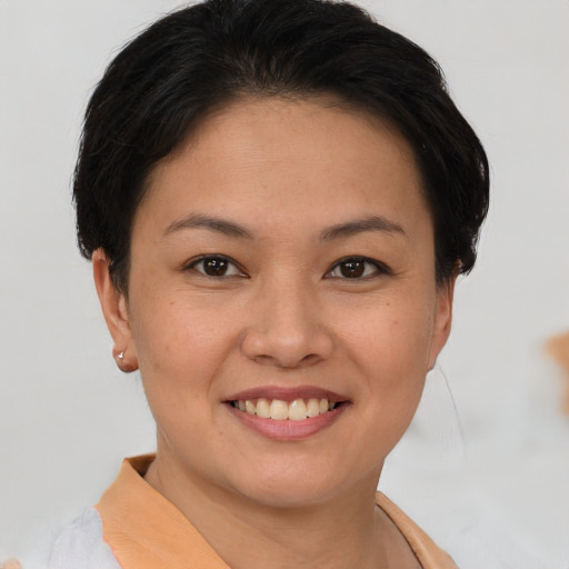 Joyful white young-adult female with short  brown hair and brown eyes