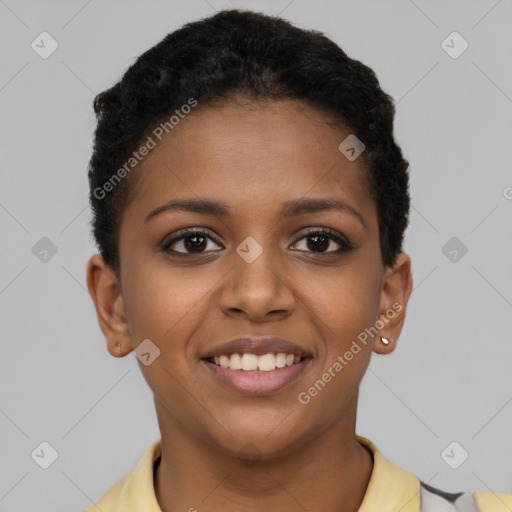 Joyful black young-adult female with short  brown hair and brown eyes