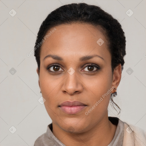 Joyful latino young-adult female with short  black hair and brown eyes