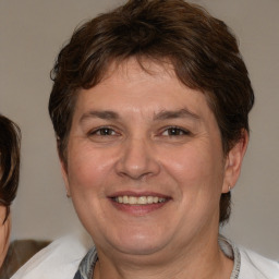 Joyful white adult male with medium  brown hair and brown eyes