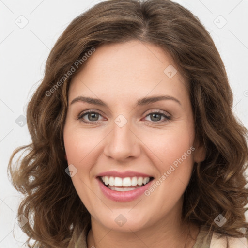 Joyful white young-adult female with long  brown hair and green eyes