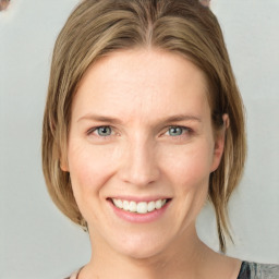 Joyful white young-adult female with medium  brown hair and blue eyes